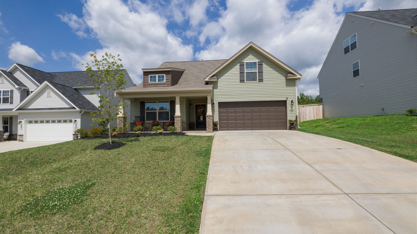 A detached suburban house with a wide driveway