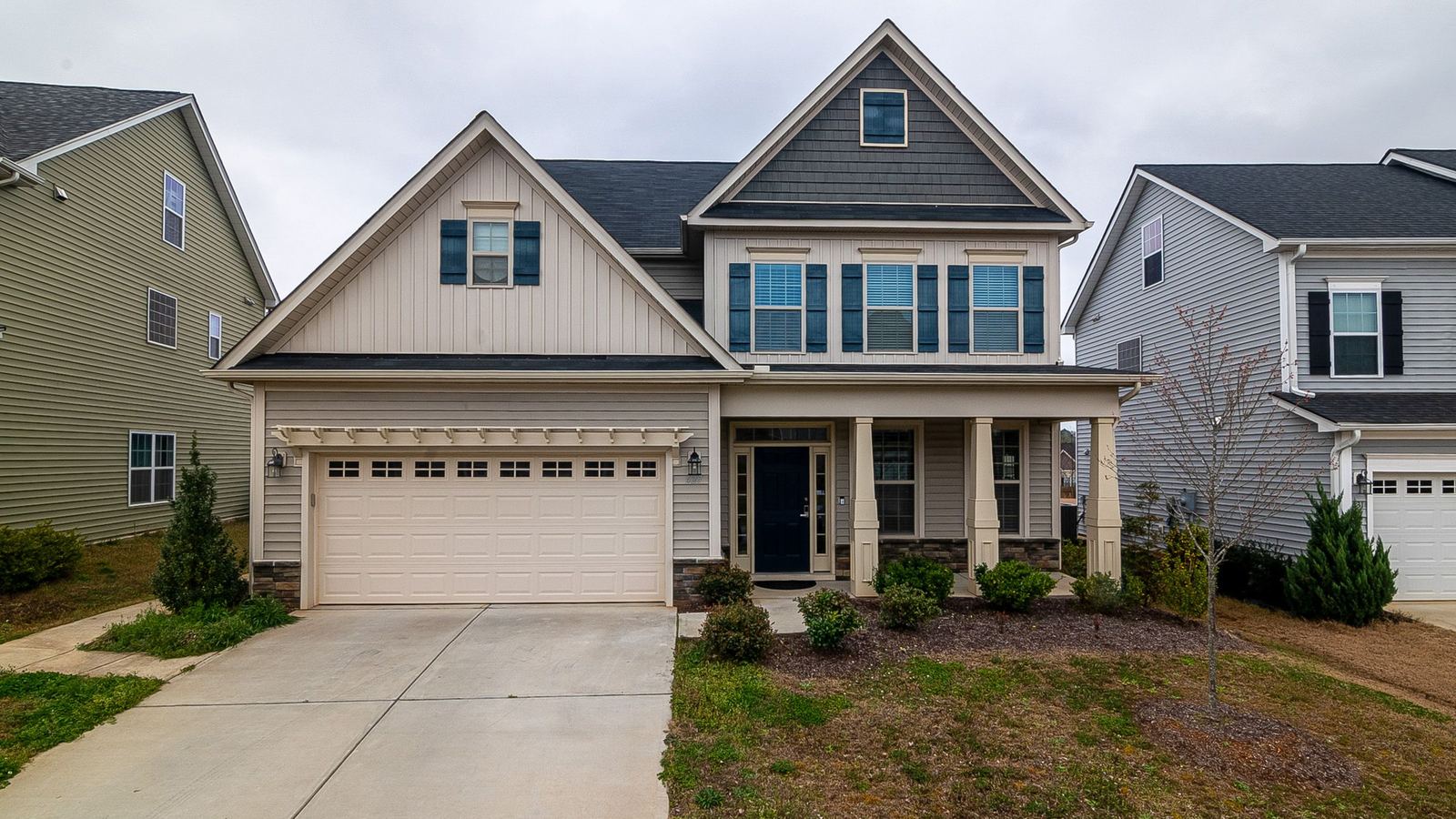A two story family home with an attached garage